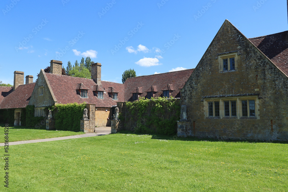 Cottages around a courtyard in the grounds of an old English country house