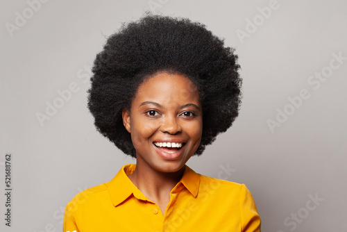 Attractive woman laughing on white background