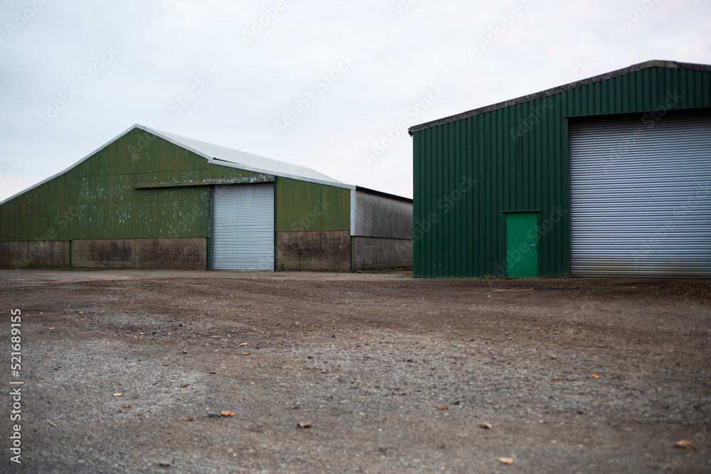 Farm barns and farm yard corrugated green countryside view