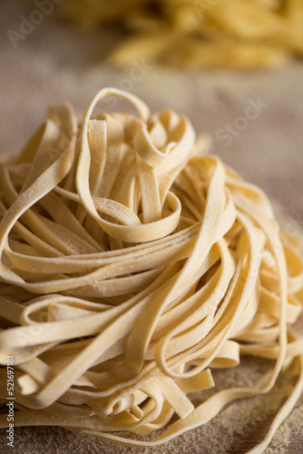 dry pasta on wooden board