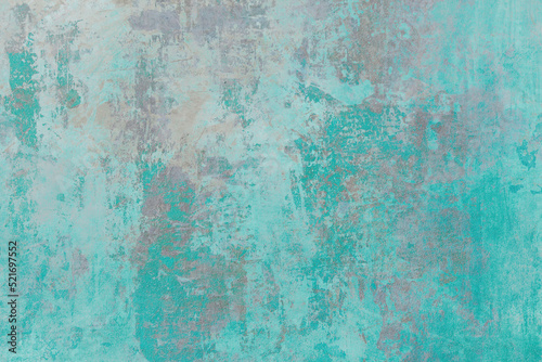 Old wall with distressed aquamarine paint grunge backgrund photo