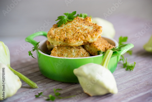 Bild auf Leinwand vegetable fried squash and zucchini cutlets in a ceramic form