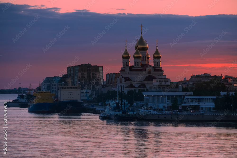 Panorama of the city of Arkhangelsk with the Archangel Michael Cathedral and port at sunset