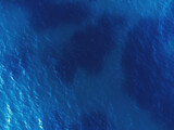 Aerial top view of blue colored sea texture with drone