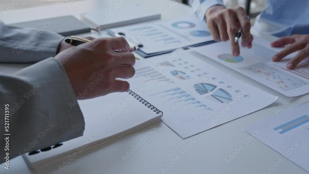 Close up of business person are discussed and brainstorming on paperwork that show accounting numbers tables on office space. Close up of business person are discussed and brainstorming on paperwork that show accounting numbers tables on office space.