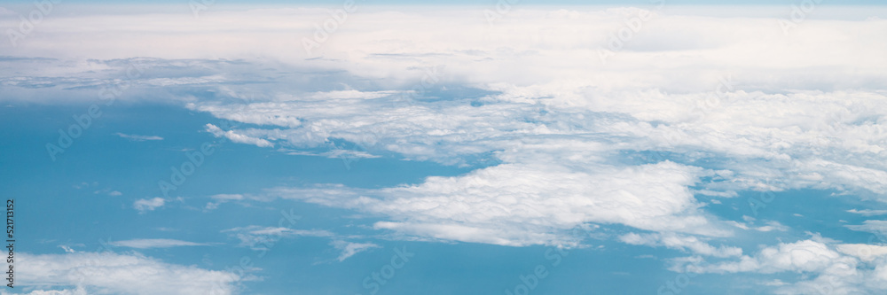 beautiful blue sky with white clouds heaven horizon over planet earth world, view from the airplane or satellite. atmosphere or stratosphere space layer. astronomy and geology sciense nature. banner beautiful blue sky with white clouds heaven horizon over planet earth world, view from the airplane or satellite. atmosphere or stratosphere space layer. astronomy and geology sciense nature. banner