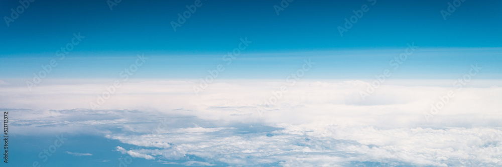 beautiful blue sky with white clouds heaven horizon over planet earth world, view from the airplane or satellite. atmosphere or stratosphere space layer. astronomy and geology sciense nature. banner beautiful blue sky with white clouds heaven horizon over planet earth world, view from the airplane or satellite. atmosphere or stratosphere space layer. astronomy and geology sciense nature. banner