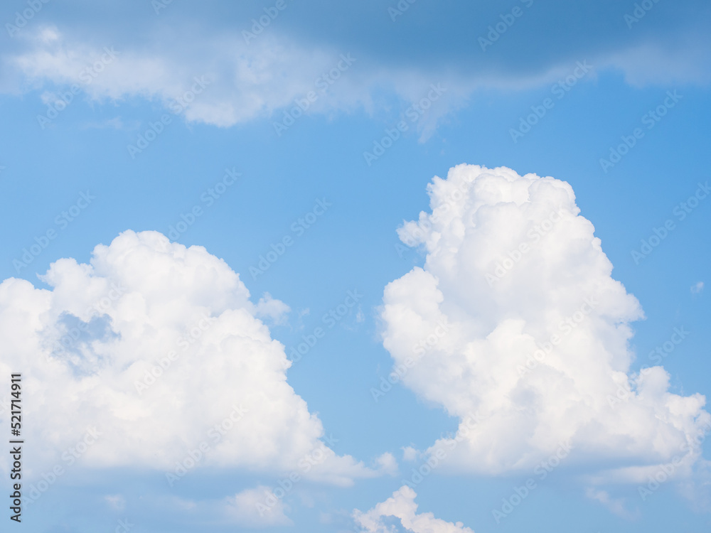 White fluffy clouds in blue sky for background White fluffy clouds in blue sky for background