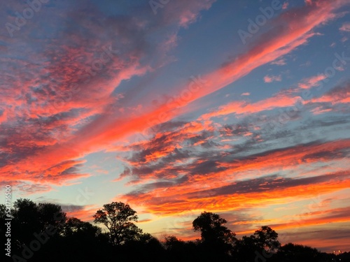 Gorgeous streaks of sunrise clouds in the skies © raksyBH