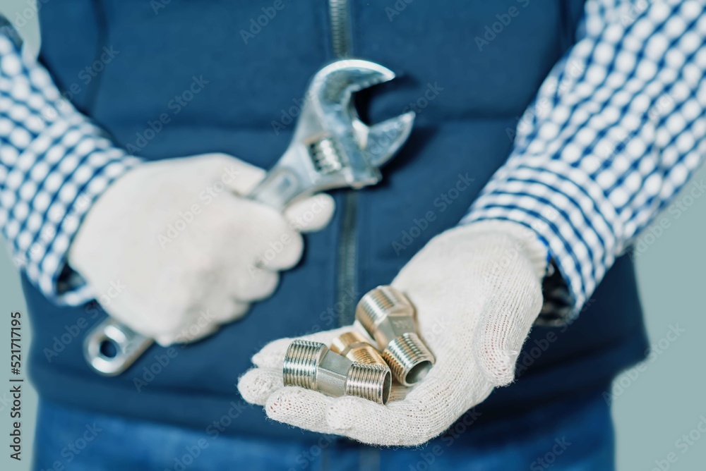 Repairman in uniform with tools