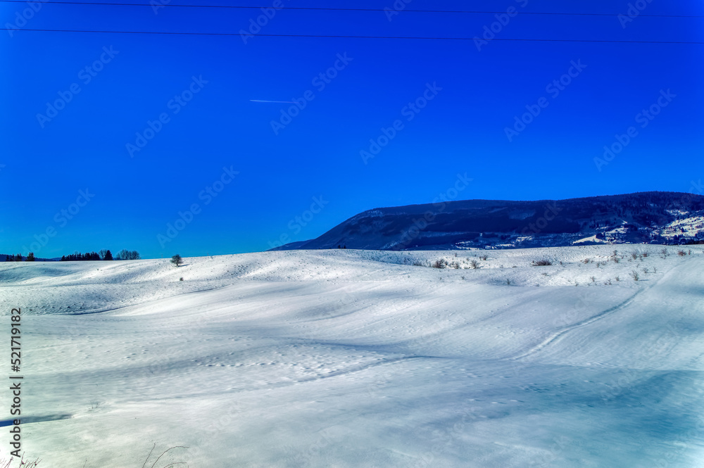 Mountain landscape in Bosnia and Herzegovina covered with snow during sunny winter day.