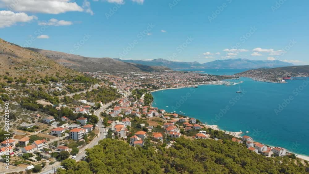 Croatia. Coast of the Adriatic Sea. Small town by the sea. Summer. Tourist season. Popular place to relaxation. Drone. Aerial view. The camera moves from left to right Croatia. Coast of the Adriatic Sea. Small town by the sea. Summer. Tourist season. Popular place to relaxation. Drone. Aerial view. The camera moves from left to right