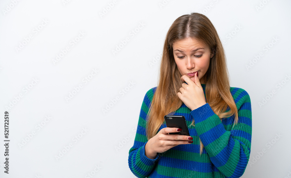 Young caucasian woman isolated on white background thinking and sending a message Young caucasian woman isolated on white background thinking and sending a message