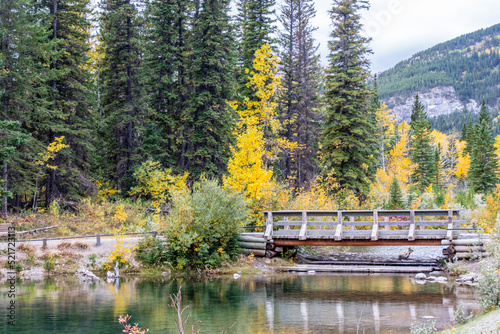 Wooden bridge over Mount Lorette Ponds. Bow Valley Wilderness Area. Alberta, Canada photo