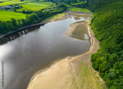 Aerial drone view of the dry reservoir basin at Lindley Wood Reservoir, North Yorkshire, UK, following heatwave 2022 and hot weather leading to drought conditions in areas of the country.