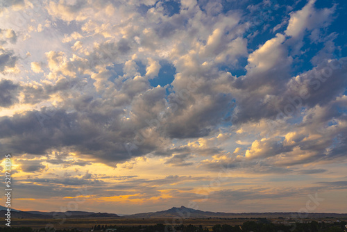 Fotografie Sunset in the sky over Heart Mountain in Cody, Wyoming, USA.