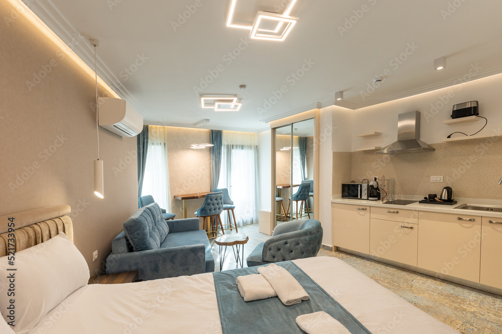 Fototapeta premium Interior of a luxury hotel apartment with kitchen