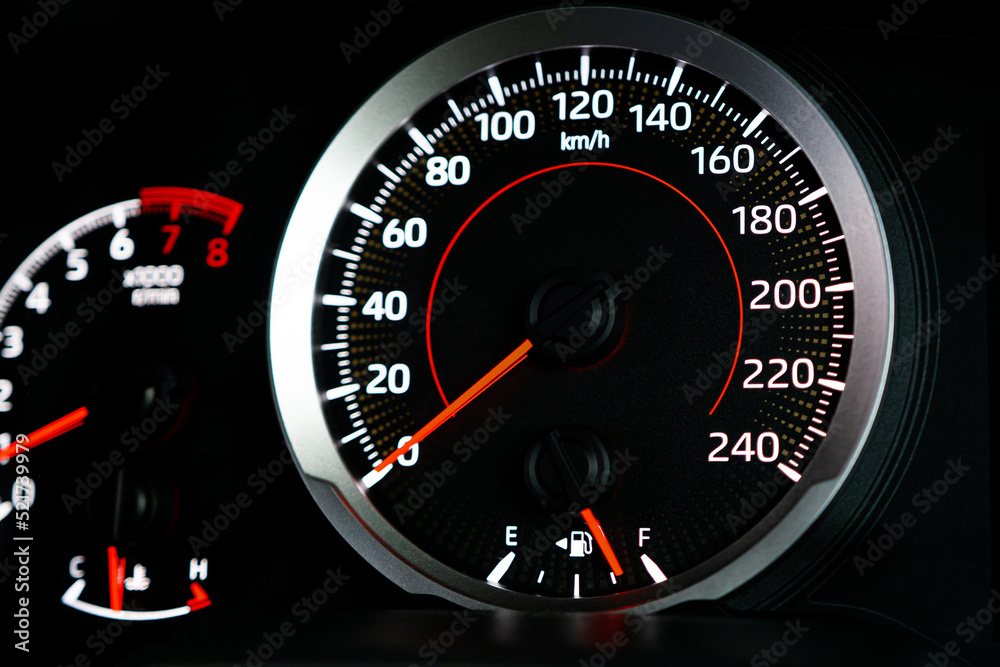 Close up fuel meter gauge shows the fuel level while in use of car