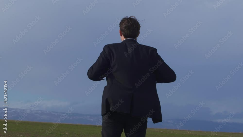 Man in suit walking in the field.
Businessman looking at horizon thoughtful. He takes off his jacket, throws it over his shoulder and walks off.
Man in suit walking in the field.
Businessman looking at horizon thoughtful. He takes off his jacket, throws it over his shoulder and walks off.