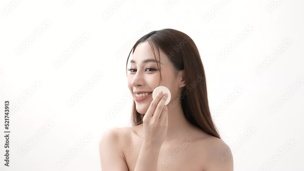 Beauty concept of 4k Resolution. Asian girls rub their cheeks with powder foundation. Beauty concept of 4k Resolution. Asian girls rub their cheeks with powder foundation.