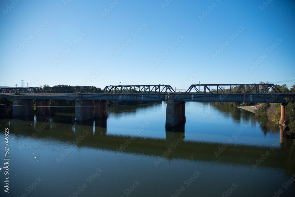 The Victoria Bridge, over Nepean River and officially known as The Nepean Bridge, is a heritage-listed former railway bridge on the Great Western Highway in the western Sydney suburb of Penrith.