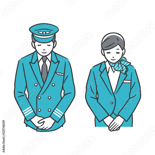 お辞儀をする機長と客室乗務員