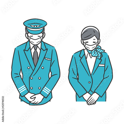 お辞儀をする機長と客室乗務員（マスク姿）