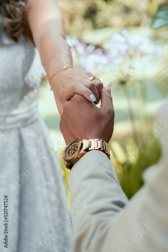 outdoor wedding rehearsal with details on the ring and bouquet photo