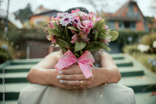outdoor wedding rehearsal with details on the ring and bouquet photo