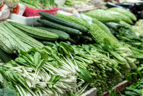 various of fresh green vegetables at the market 