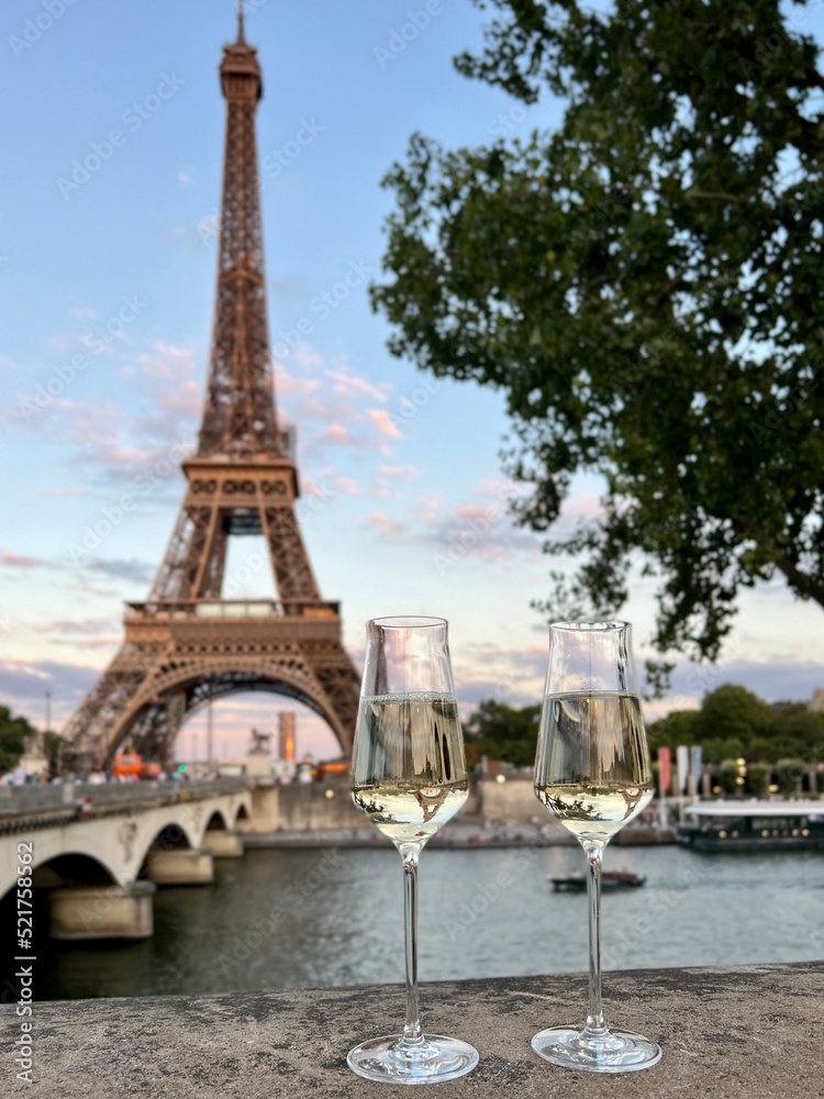 Glasses of white wine with Eiffel Tower