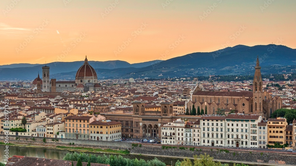 Panoramic view of the center of Florence with gothic cathedral, the Duomo,  named in honor of Santa Maria del Fiore, Italy, Tuscany, at summer sunset 