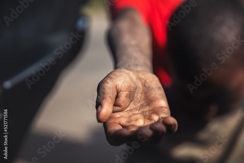 Man's hand begging for alms. Poverty in Africa. 