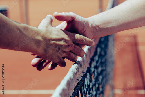 handshake between two people on the background of the sky