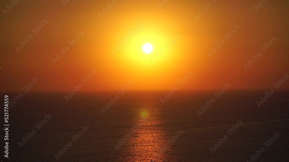 Abstract nature summer ocean sunset sea background. Small waves on water surface in motion blur with bokeh lights from sunrise. Holiday, vacation and recreational background concept Abstract nature summer ocean sunset sea background. Small waves on water surface in motion blur with bokeh lights from sunrise. Holiday, vacation and recreational background concept