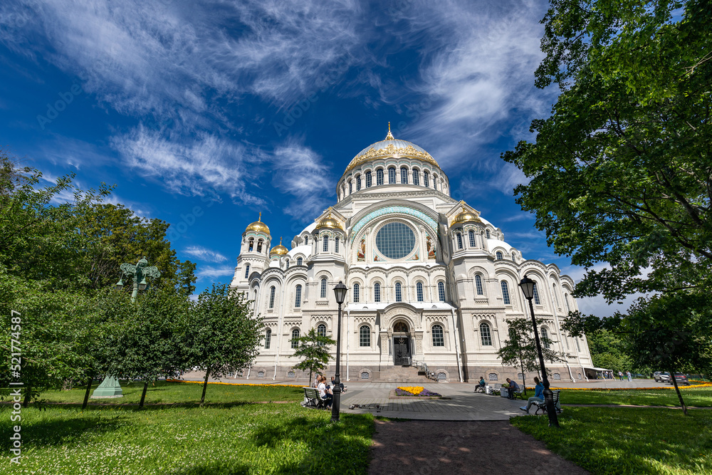 Fototapeta premium The Naval Cathedral in the city of Kronstadt near St. Petersburg in summer against the background of a blue sky with clouds