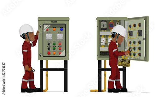 Industrial workers use clamp meter to measuring electric current in the electrical control cabinet
