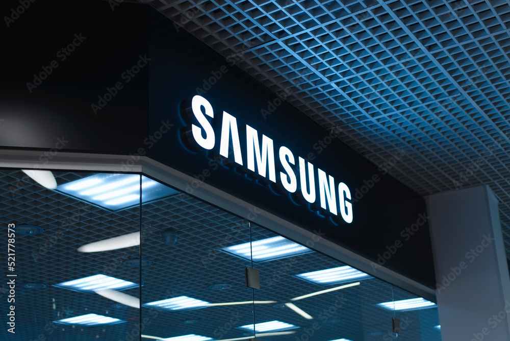Illuminated Samsung logo sign inside a supermarket. Shop of electronics and  household appliances of the South Korean company. Smolensk, Russia  03.08.2022 Photos | Adobe Stock
