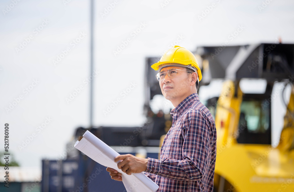 Engineer man with blueprint checking and inspect container in industry cargo, Foreman dock worker in hardhat control loading containers box from cargo Engineer man with blueprint checking and inspect container in industry cargo, Foreman dock worker in hardhat control loading containers box from cargo