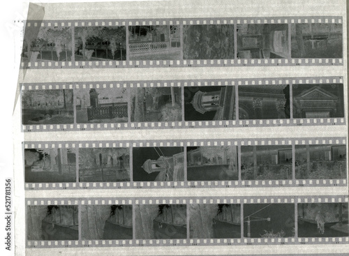 stack of old negative photographic films in a sheet of parchment