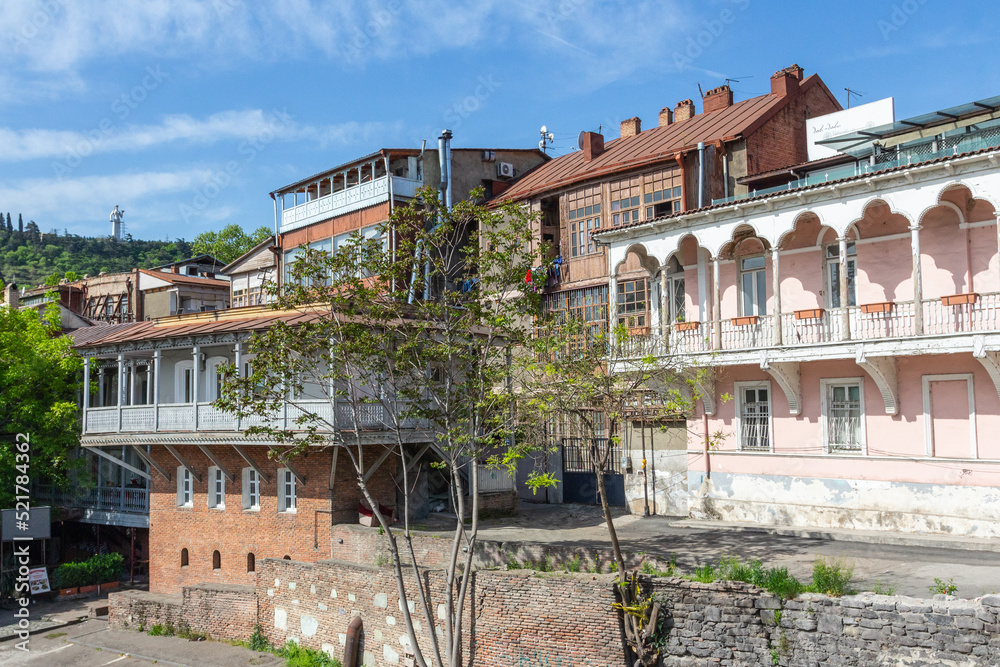 A view of a historic house with a beautiful wooden balcony in the Old Town of Tbilisi. Georgia