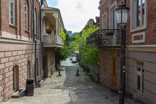 Fototapeta Naklejka Na Ścianę i Meble -  A narrow street in the historical part of Tbilisi. Georgia
