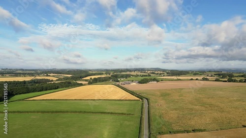 Eccup Reservoir and Yorkshire countryside surrounding North Leeds. Panning drone shot and aerial view of agricultural fields  photo