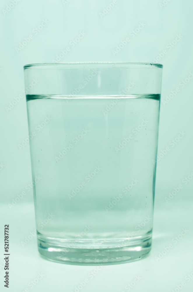 water on a transparent glass. For health concepts. Isolated white background. water on a transparent glass. For health concepts. Isolated white background.