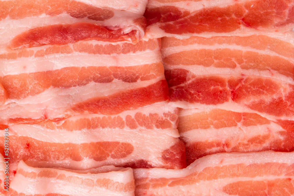 Raw bacon slices isolated on a white background. Raw bacon slices isolated on a white background.