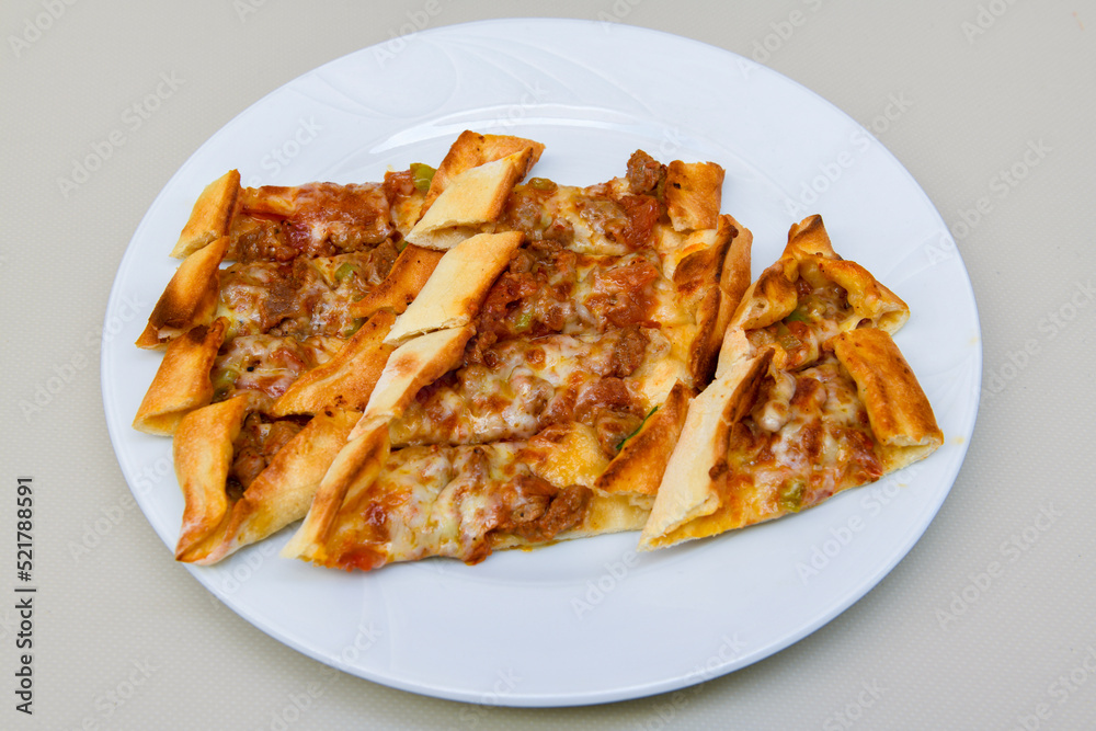 Kiymali pide. Turkish pide with minced meat. Turkish pizza mince pita Pide on white background. Etli ekmek. Kusbasi kasarli, kiymali kasarli, kiymali yumurtali, Bafra, Trabzon, Kusbasili pide.