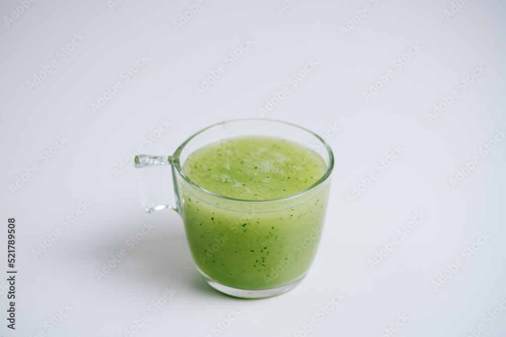Kiwi and orange blended fruit juice with isolated white background. Kiwi and orange blended fruit juice with isolated white background.