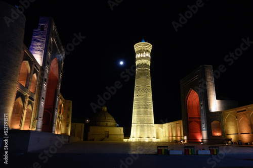 Architecture of the Uzbek city of Bukhara at night with illumination.