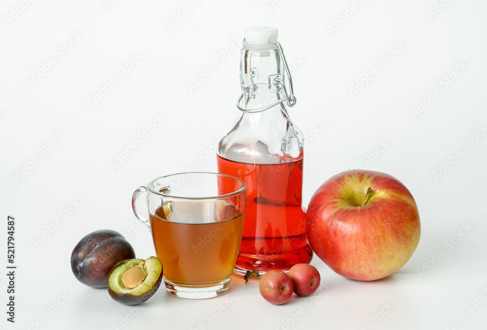 fruit juice in a glass and a bottle plum apple fruit juice in a glass and a bottle plum apple