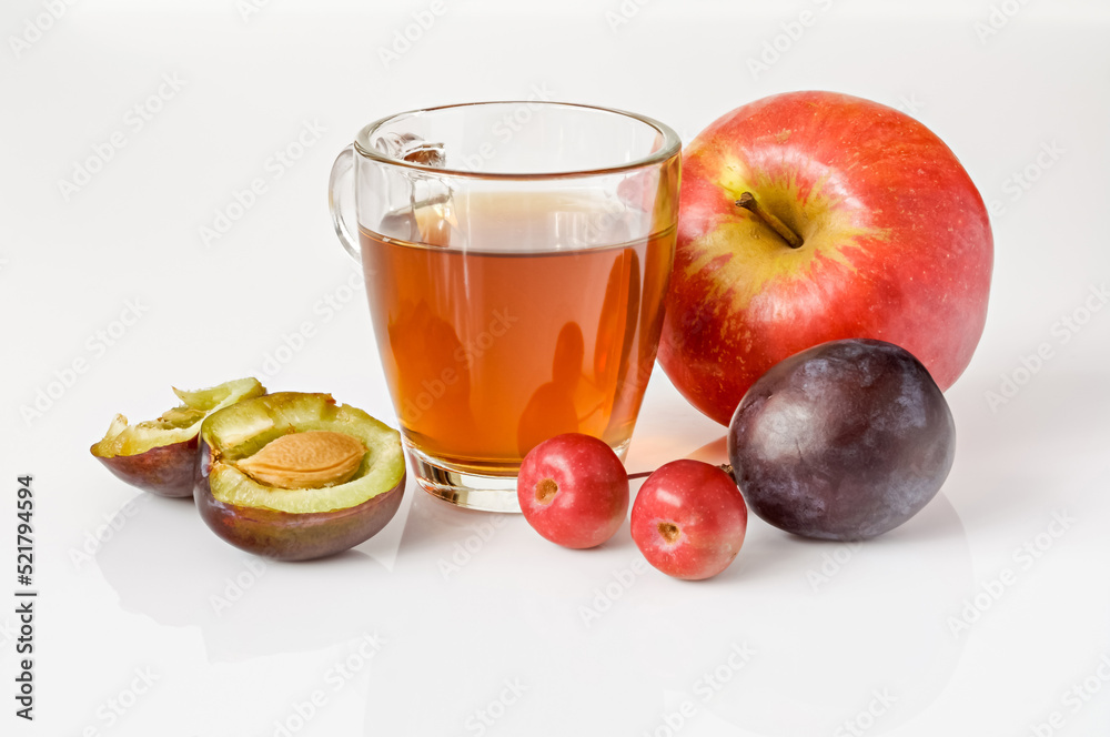 fruit juice in a glass and plum apple fruit juice in a glass and plum apple